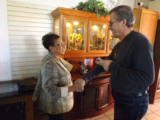 Assemblymember-Elect Cheryl Brown introduces herself to Frank, the store owner of Sierra Car Wash in Fontana after receiving a car wash. 